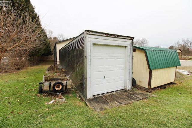 garage with a lawn