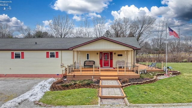 view of front of house with a front lawn and a porch