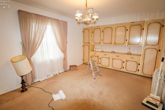 interior space with light carpet and an inviting chandelier