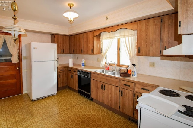 kitchen featuring pendant lighting, sink, white appliances, and backsplash