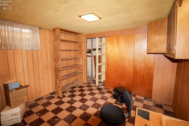 interior space featuring wood walls