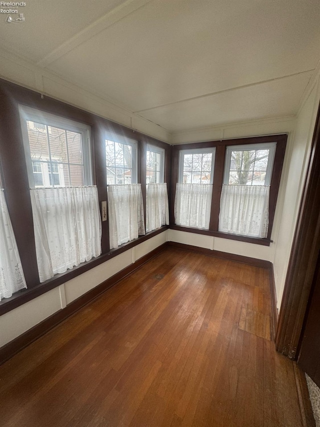 unfurnished sunroom featuring a healthy amount of sunlight