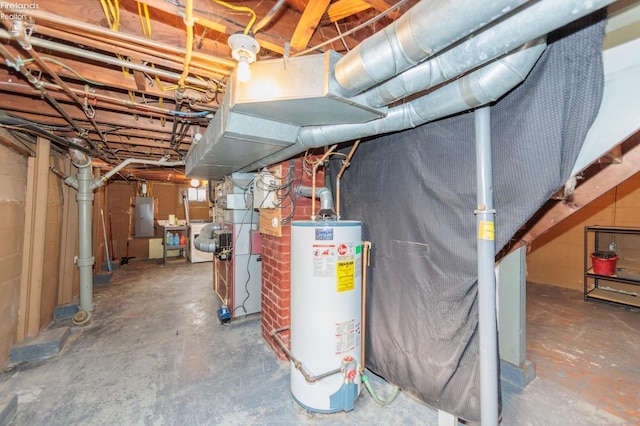 basement featuring water heater and electric panel