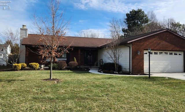 ranch-style house featuring a garage and a front yard