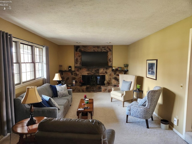 carpeted living room with a stone fireplace and a textured ceiling