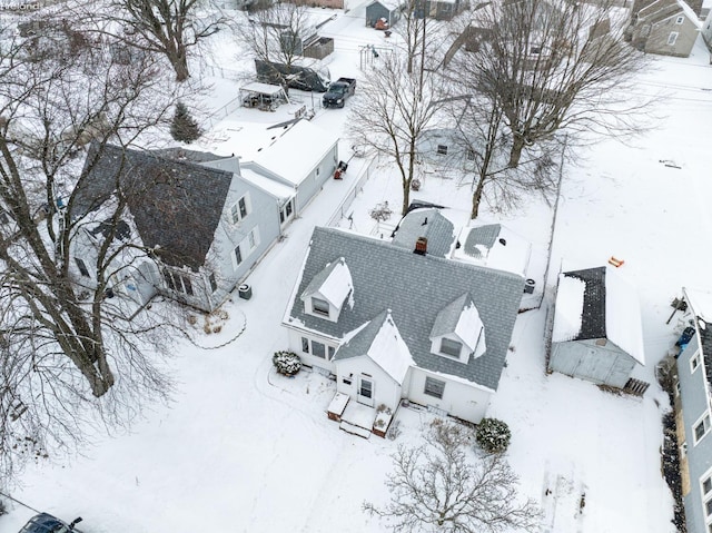 snowy aerial view featuring a residential view