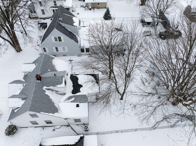 snowy aerial view featuring a residential view