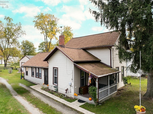 view of front of home with a front lawn and covered porch