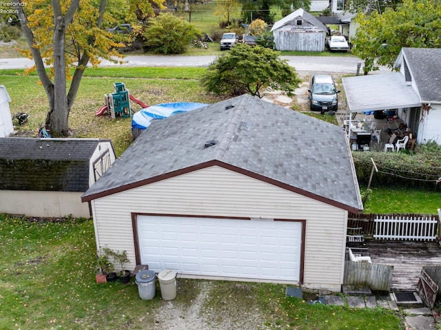 garage featuring a lawn