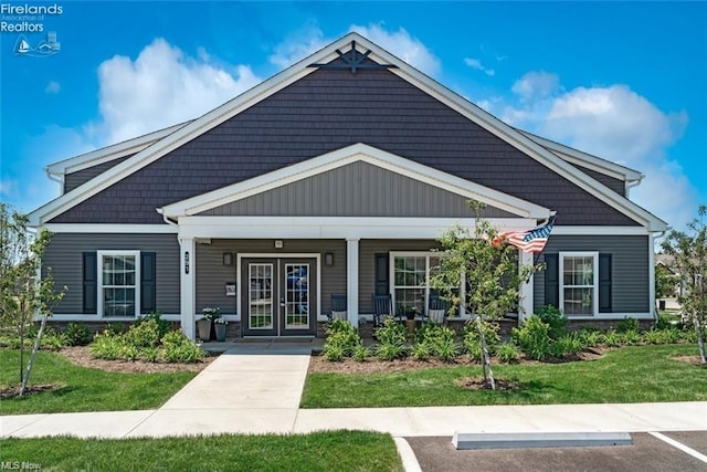 view of front of house featuring a front yard and covered porch