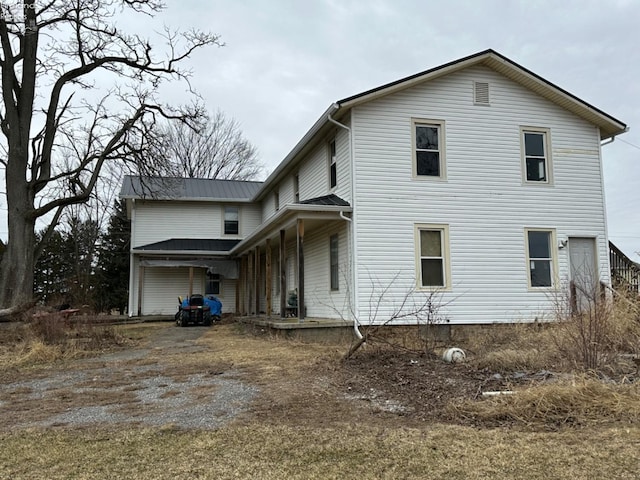 rear view of house with a garage