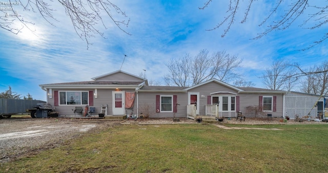 single story home featuring a front lawn