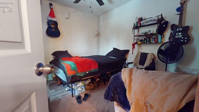 carpeted bedroom with ceiling fan