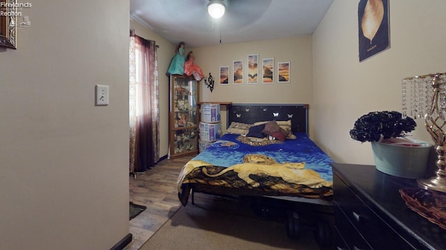 bedroom featuring ceiling fan and light hardwood / wood-style floors