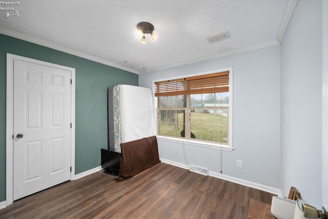 unfurnished room with dark wood-type flooring and ornamental molding