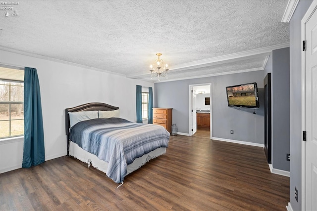 bedroom with ornamental molding, dark hardwood / wood-style floors, a textured ceiling, and a chandelier