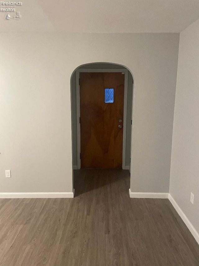 spare room with dark hardwood / wood-style floors