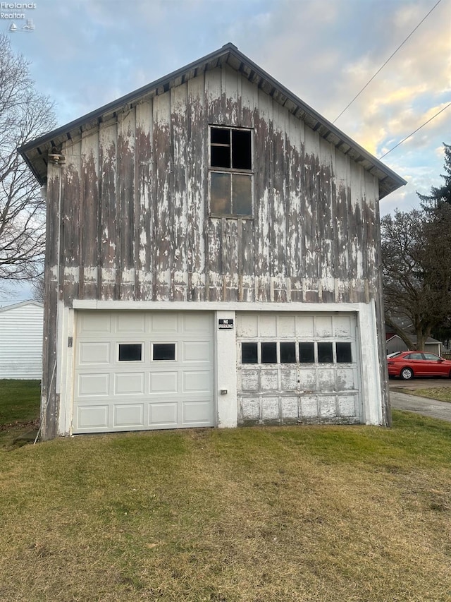 garage with a lawn