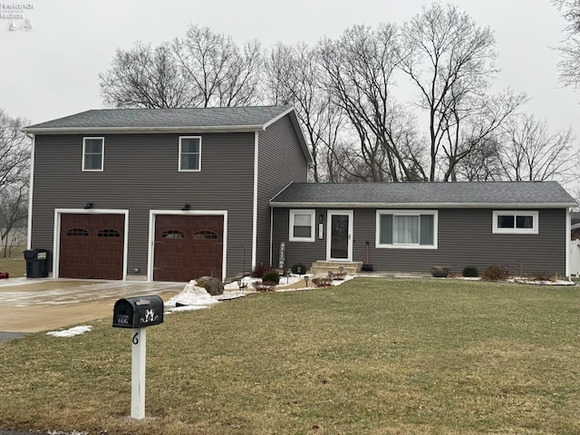 view of front of home with a garage and a front lawn