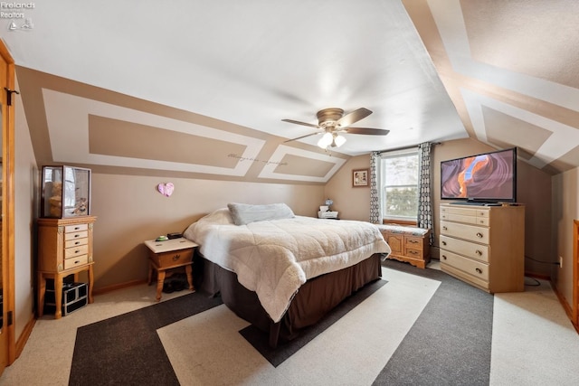 bedroom with ceiling fan, vaulted ceiling, and light carpet