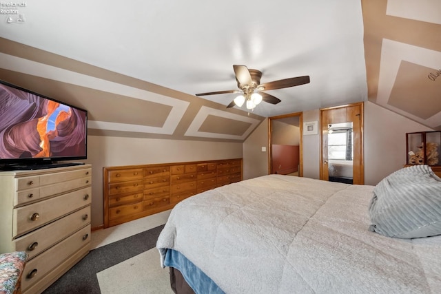 bedroom with vaulted ceiling, ceiling fan, and dark colored carpet