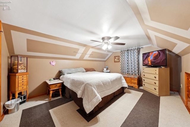 carpeted bedroom featuring ceiling fan and lofted ceiling