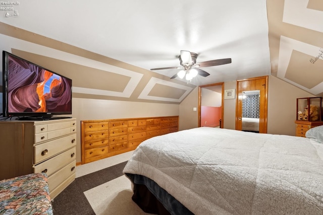 bedroom featuring vaulted ceiling, carpet floors, and ceiling fan