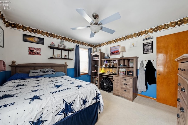 bedroom with light colored carpet and ceiling fan