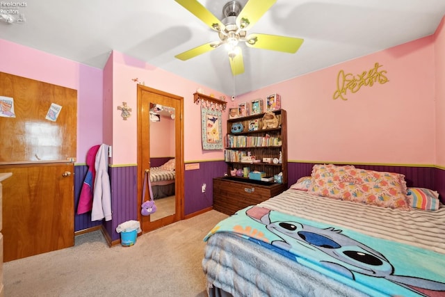 bedroom featuring light colored carpet and ceiling fan