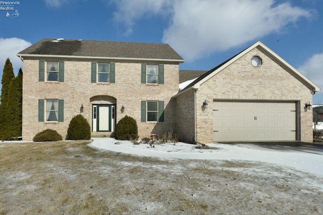 colonial home featuring a garage