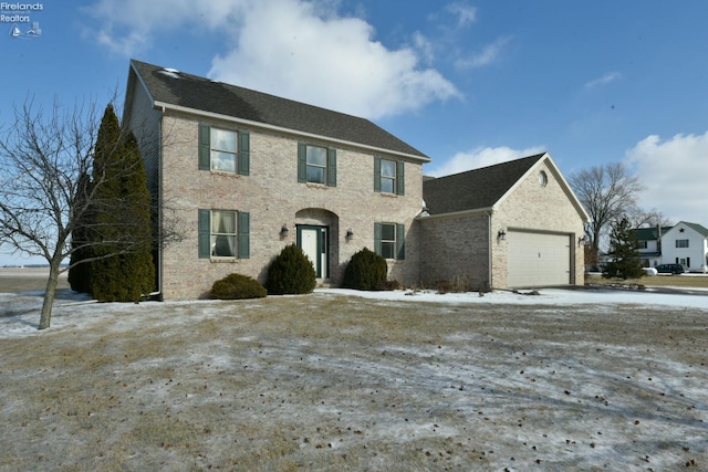 colonial home with a garage