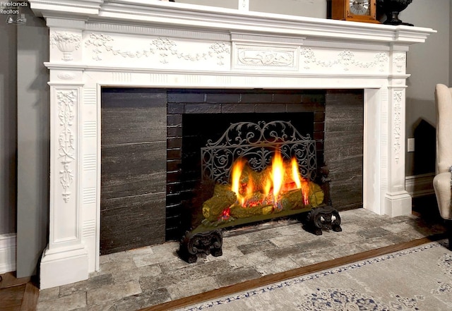 room details featuring a tile fireplace