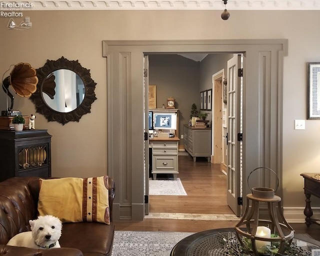 interior space with wood-type flooring and a wood stove