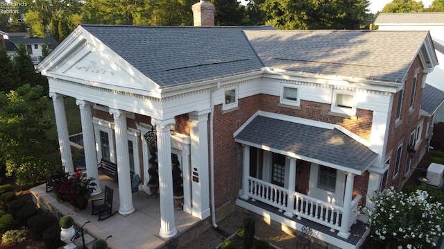 back of house with covered porch