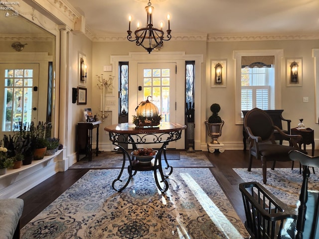 dining room with a notable chandelier, ornamental molding, and dark hardwood / wood-style floors