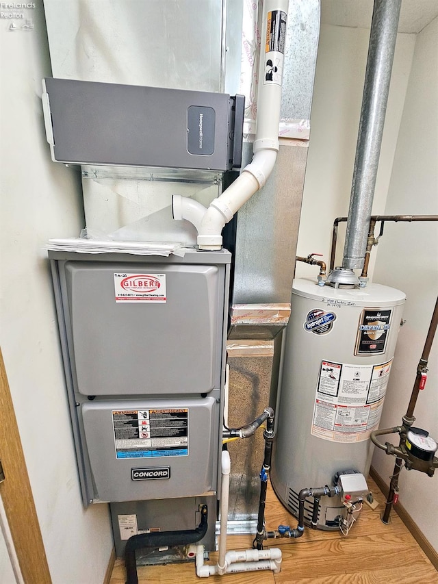 utility room featuring gas water heater