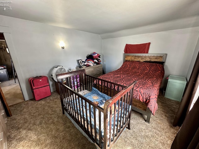 carpeted bedroom with vaulted ceiling