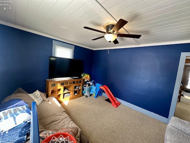 bedroom with ceiling fan, carpet flooring, wood ceiling, and ornamental molding