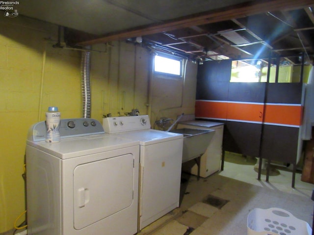 laundry area featuring sink and washer and dryer