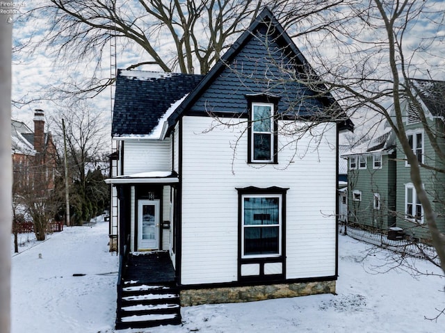 view of front of property with roof with shingles