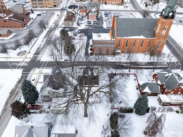 snowy aerial view with a residential view