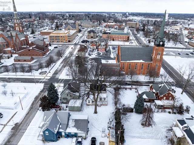 snowy aerial view with a residential view