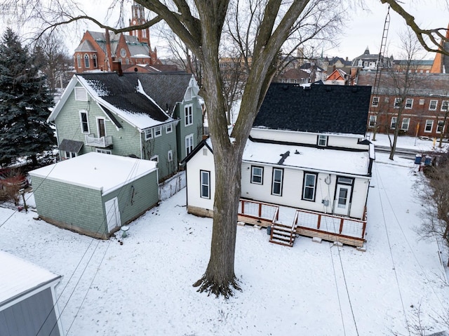 snowy aerial view featuring a residential view