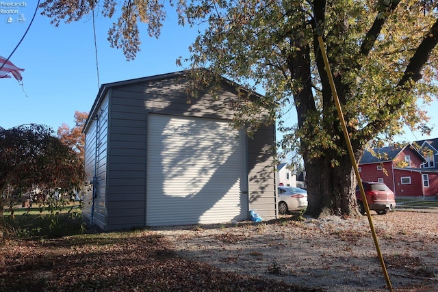 view of home's exterior featuring a garage and an outdoor structure