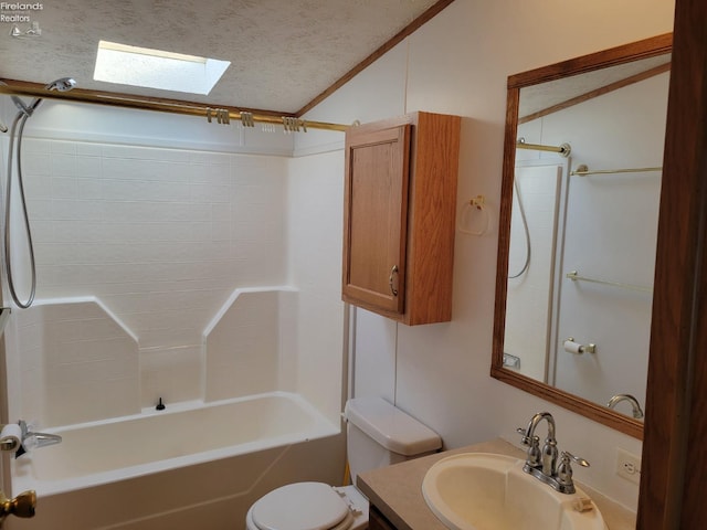 full bath with a textured ceiling, toilet, shower / bath combination, a skylight, and vanity