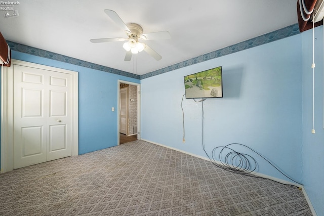 unfurnished bedroom with carpet and ceiling fan