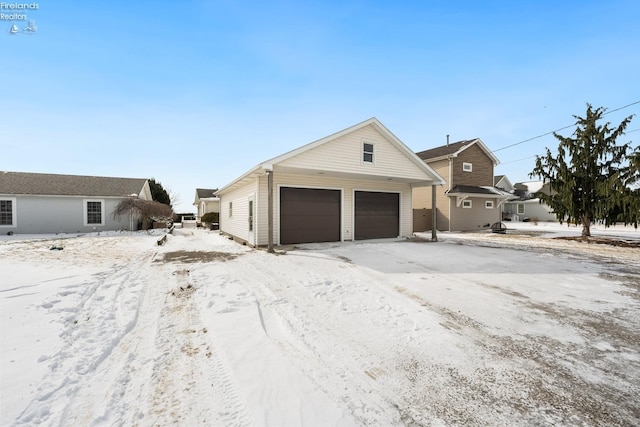 view of snow covered garage