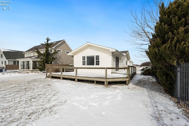 view of front of property with fence and a wooden deck