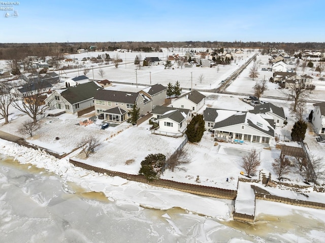 snowy aerial view featuring a residential view