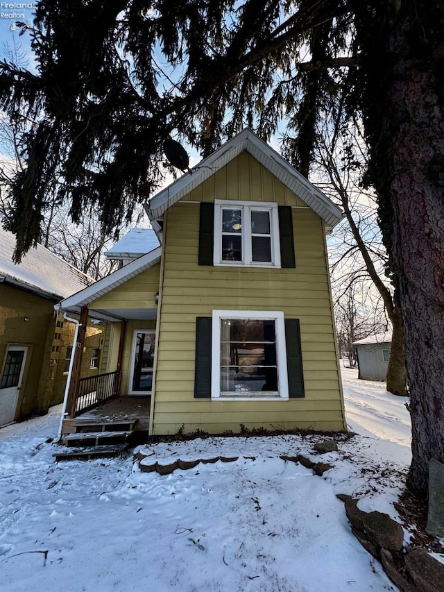 view of front of house featuring covered porch and board and batten siding